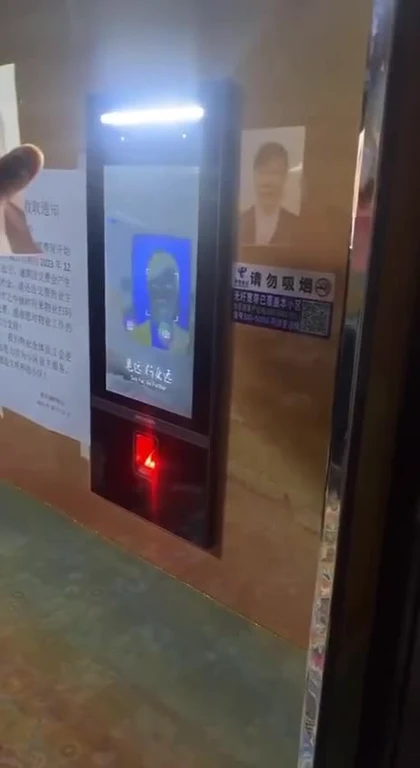 Facial recognition terminal with a red light on, indicating a failed scan.