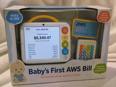 Toy packaging for a baby calculator displaying a high AWS bill and a credit card, labeled with existential dread.