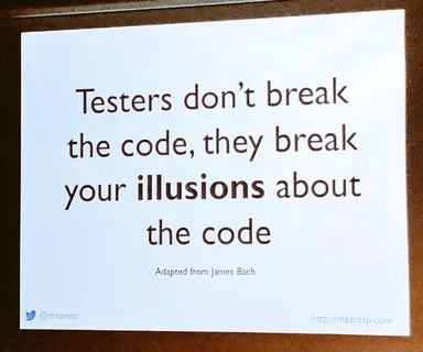 White printed card with the quote: Testers don't break the code, they break your illusions about the code. Adapted from