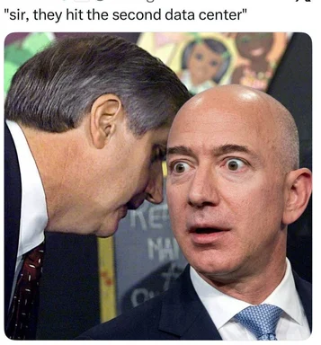 Two businessmen in suits, one whispering in the other's ear with a shocked expression, captioned 'sir, they hit the second data center'