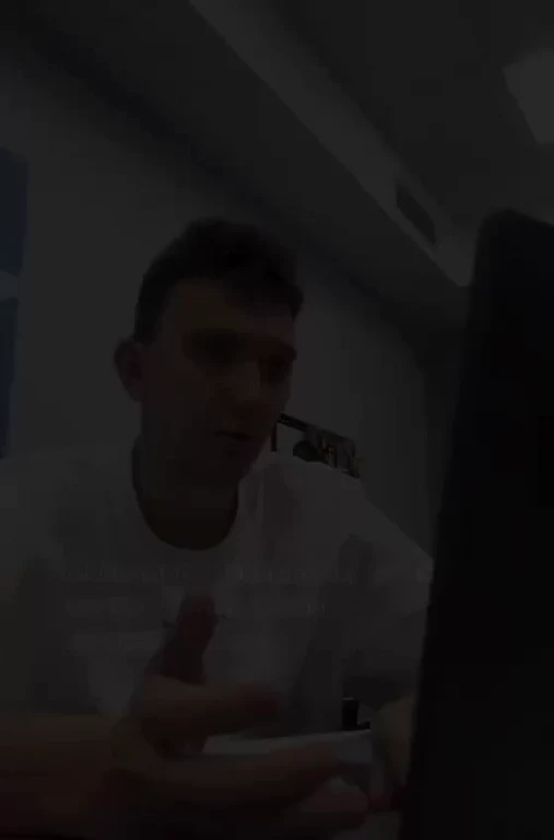 Man looking at screen with a reaction
