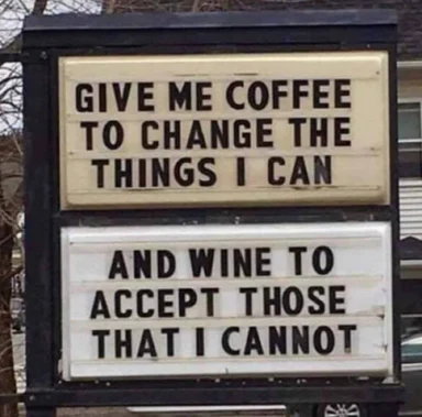 sign with two boards: 'give me coffee to change the things i can' and 'and wine to accept those that i cannot'