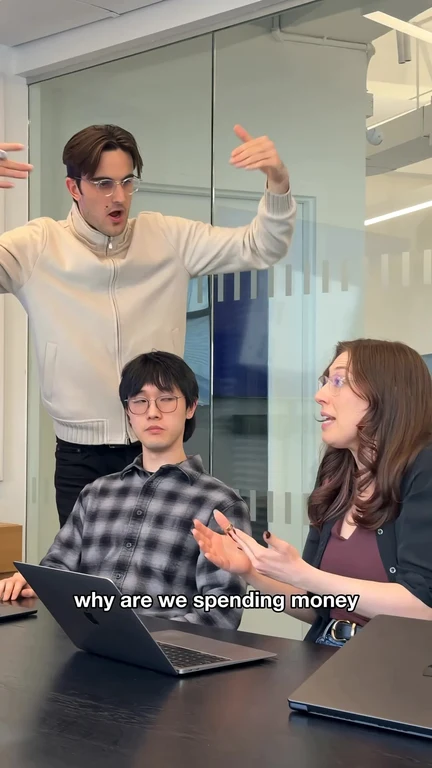 office workers discussing spending money