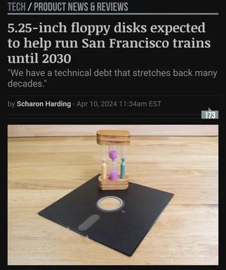 a photo of an hourglass on a floppy disk with a caption about 5.25-inch floppy disks expected to help run San Francisco trains until 2030