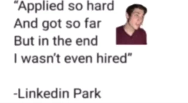 A disappointed man with a meme about applying to jobs and not getting hired