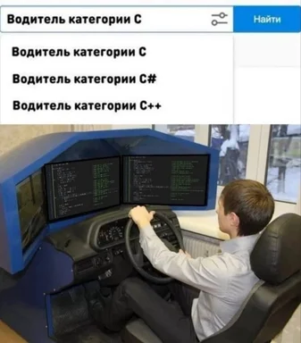 a man sitting in a driving simulator with code on the screens