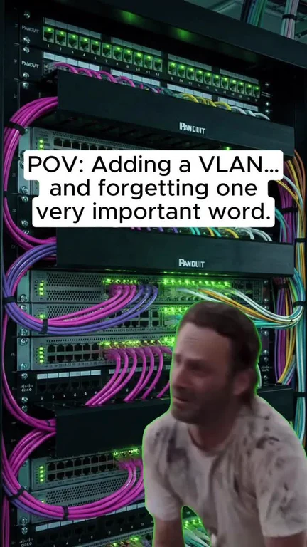 Man looking shocked in front of network server with VLAN text overlay