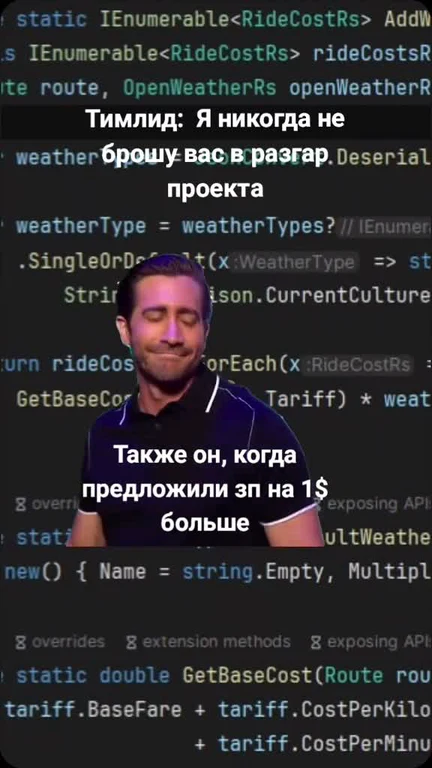Man in front of computer screen with code, looking determined