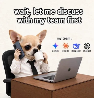Chihuahua in a dress shirt and tie sitting at a desk with a laptop, holding a phone and coffee mug, captioned 'wait, let me