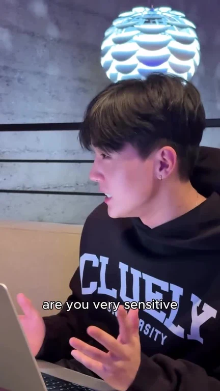 a person reacting sensitively to something on their laptop