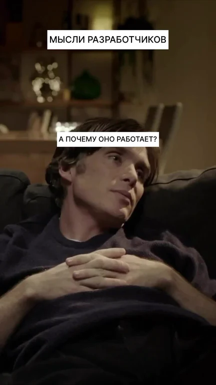 a man sitting on a couch with a confused expression
