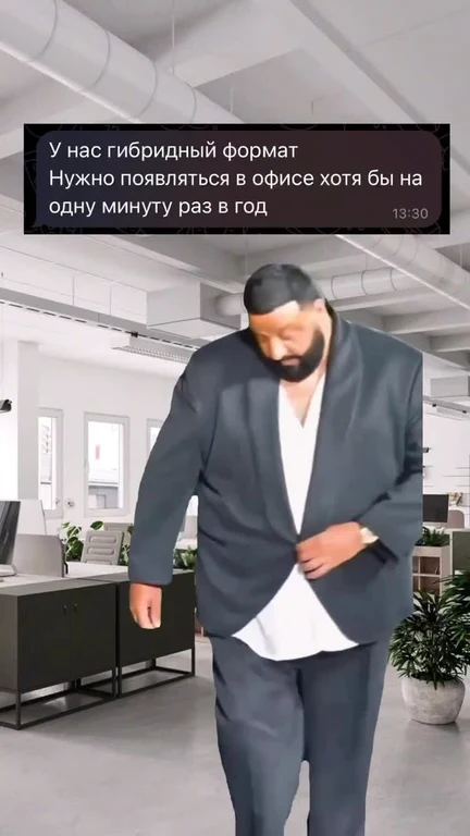 Man in suit walking into office with text about hybrid work format