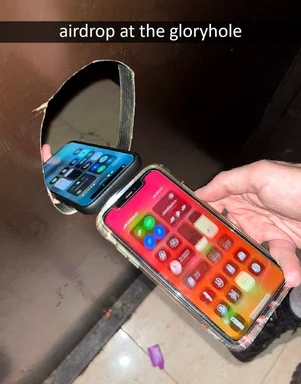 Two smartphones with different colored screens are shown in a toilet bowl