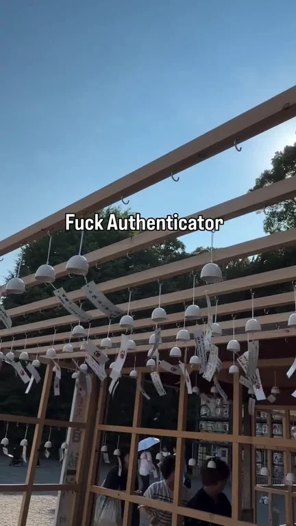 A video preview of a shrine with wind chimes and the text 'Fuck Authenticator' overlaid.