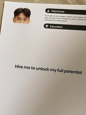 A resume with a photo of a man and the text 'Hire me to unlock my full potential'
