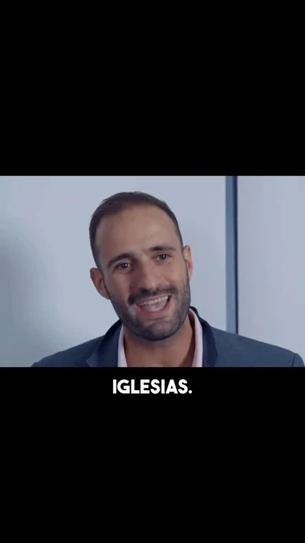 Enrique Iglesias smiling in a video thumbnail with the text IGLESIAS.