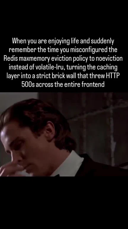Man in suit facepalming with text about Redis noeviction policy causing HTTP 500s