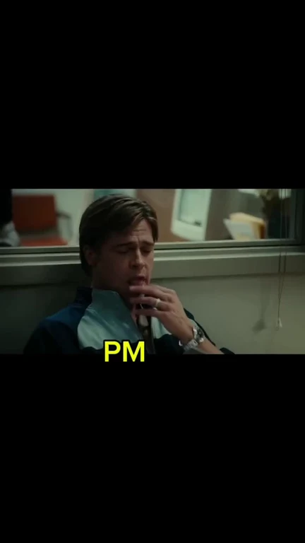 A man in a blue shirt looking concerned with 'PM' text overlay