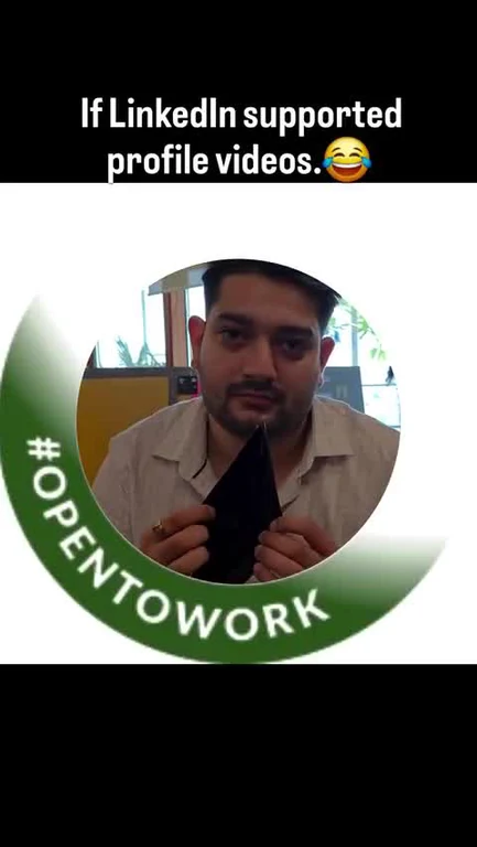 A man holding a black cloth to his chest with a green Open to work ring around his profile picture, captioned 'If LinkedIn supported profile videos.'