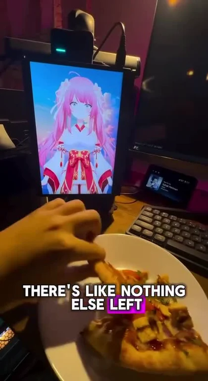 A hand holding a slice of pizza in front of an anime character on a computer screen with the text 'THERE'S LIKE NOTHING ELSE LEFT'