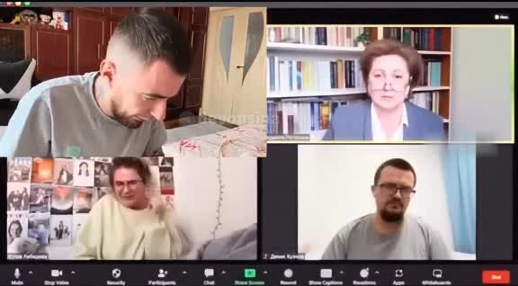 A screenshot of a video call with four participants, one looking dejected or disappointed