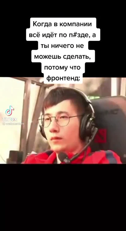 a man wearing headphones and a red jacket looking unamused