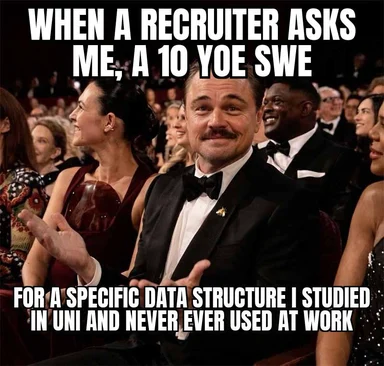 Smiling man in tuxedo reacting to recruiter question about data structures