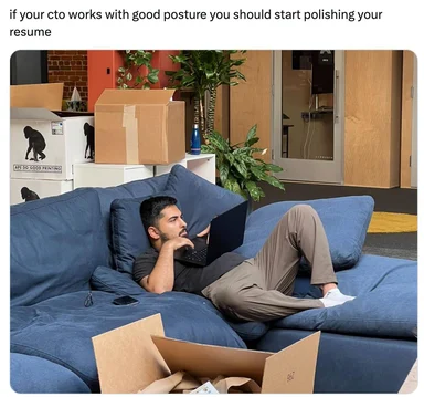 man lounging on a blue couch with laptop, surrounded by boxes, with a caption about cto posture and resume polishing