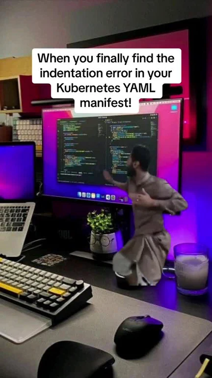 Relieved developer jumping up from desk after fixing Kubernetes YAML indentation error on computer screen