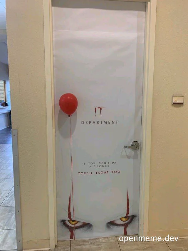 IT department door with a red balloon and a threatening message