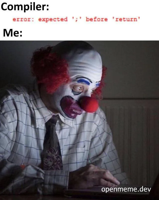 Clown with shocked expression looking at laptop