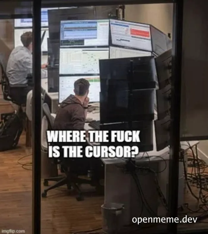 Man sitting at computer with multiple monitors looking frustrated