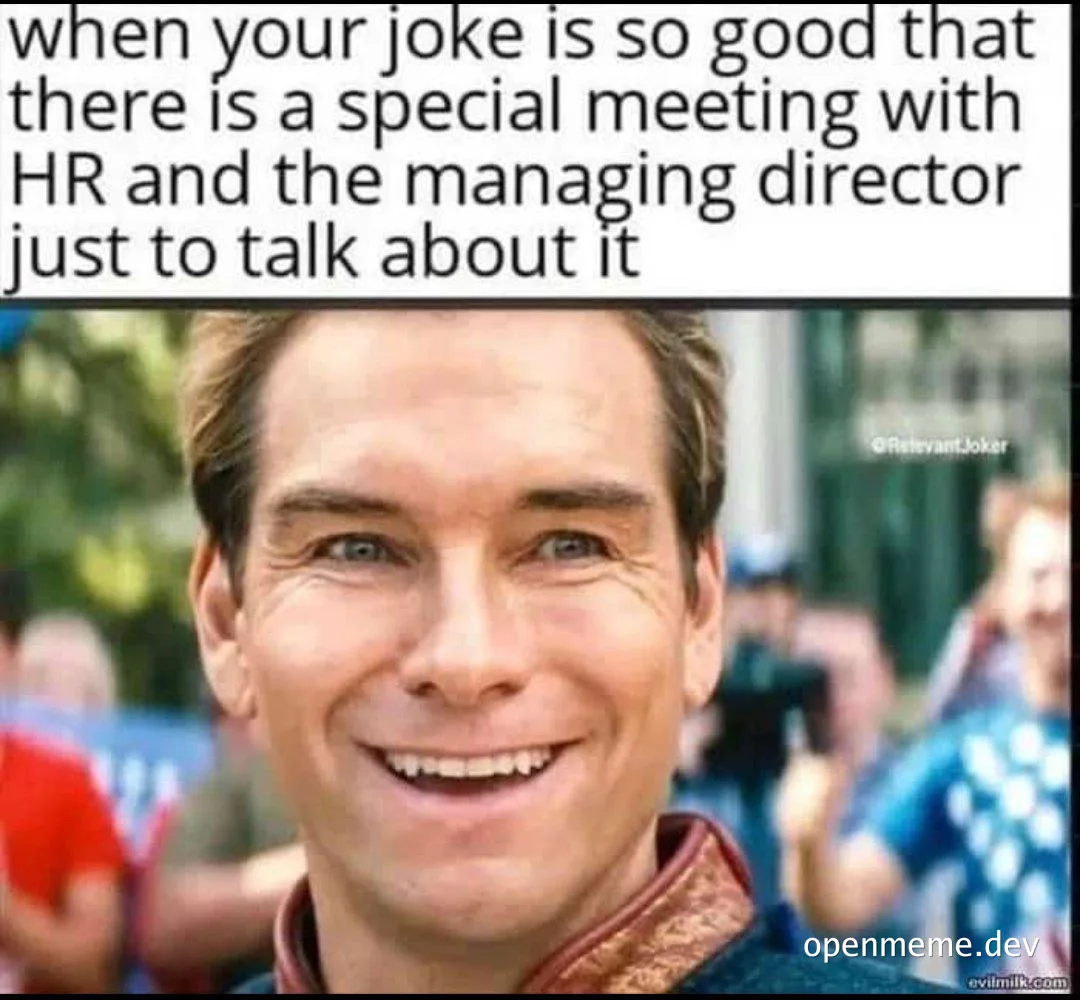 Smiling man with a cheesy grin, implying a joke well-received.