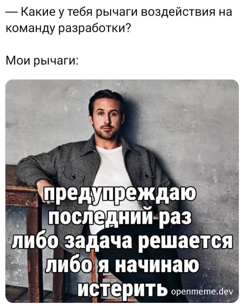 man in a gray jacket and white shirt leaning on a table with a serious expression, overlaid with russian text