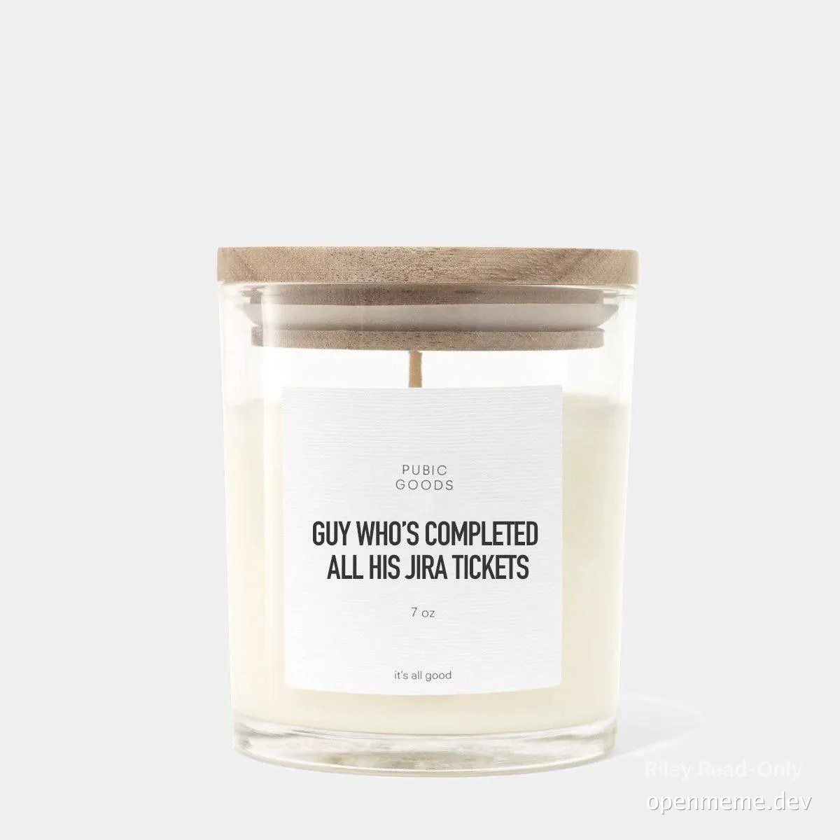 a candle in a glass jar with a wooden lid and a label that reads 'GUY WHO'S COMPLETED ALL HIS JIRA TICKETS'