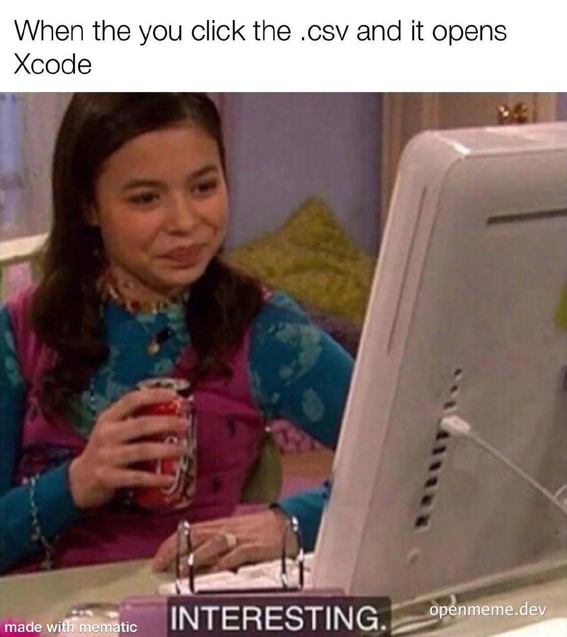a woman sitting at a computer with a surprised expression