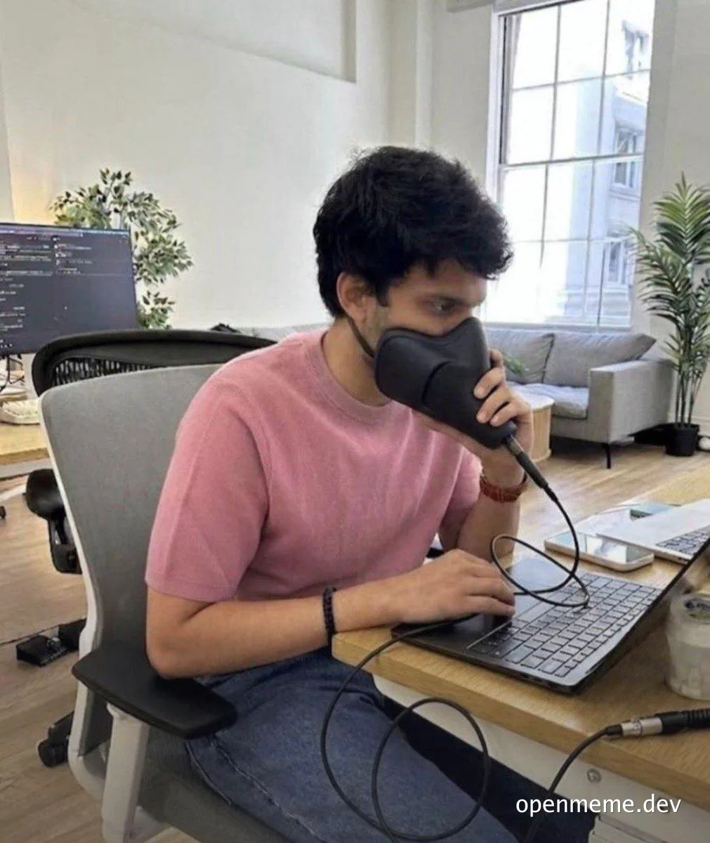 programmer with a hair dryer on their face