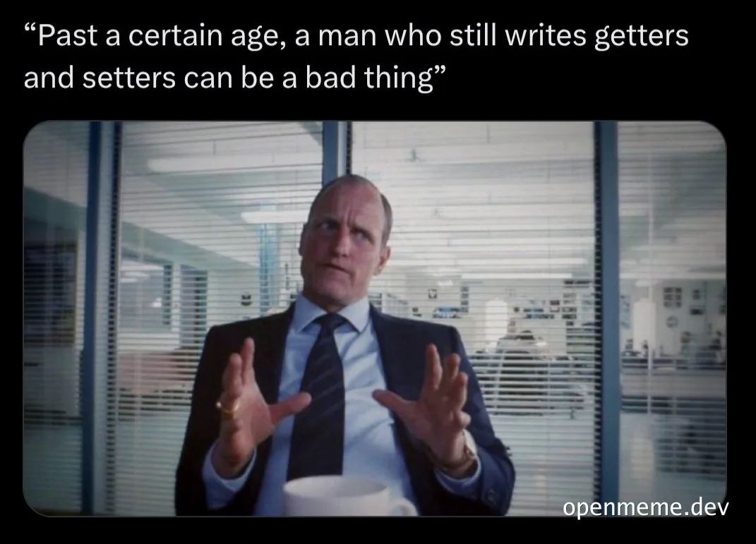 Man in a suit gesturing with a coffee cup with text about writing getters and setters.