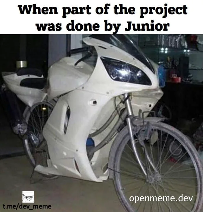 a white motorcycle with a bicycle attached to it