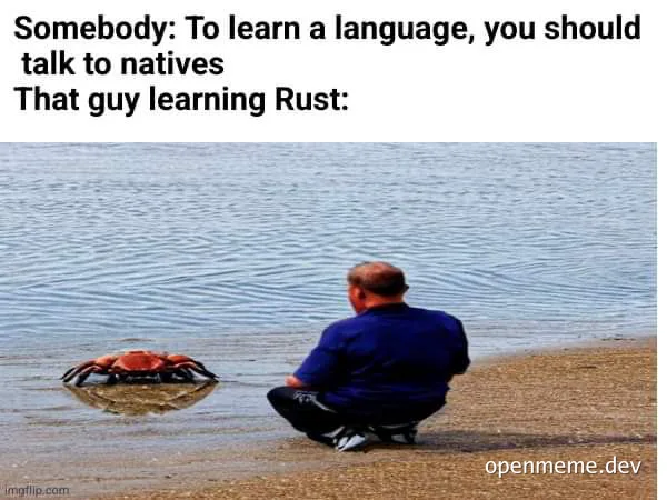 man sitting on beach talking to crab