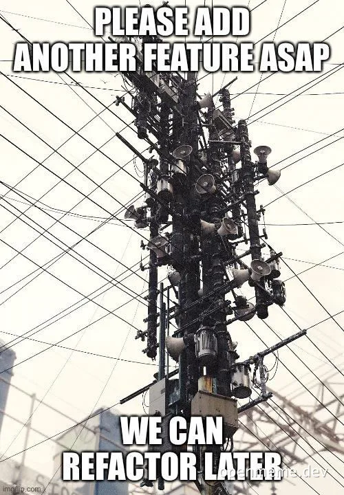 overloaded electrical tower with many wires and devices