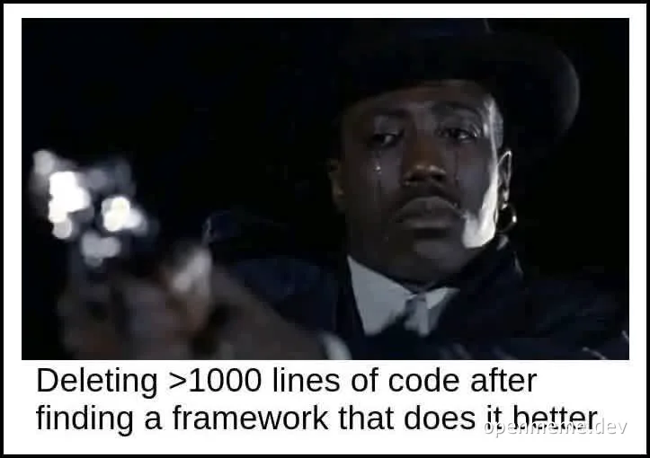 Sad man in a suit and hat crying while holding a gun, with text about deleting code