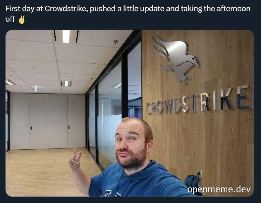 Man in blue hoodie making a peace sign in front of Crowdstrike office