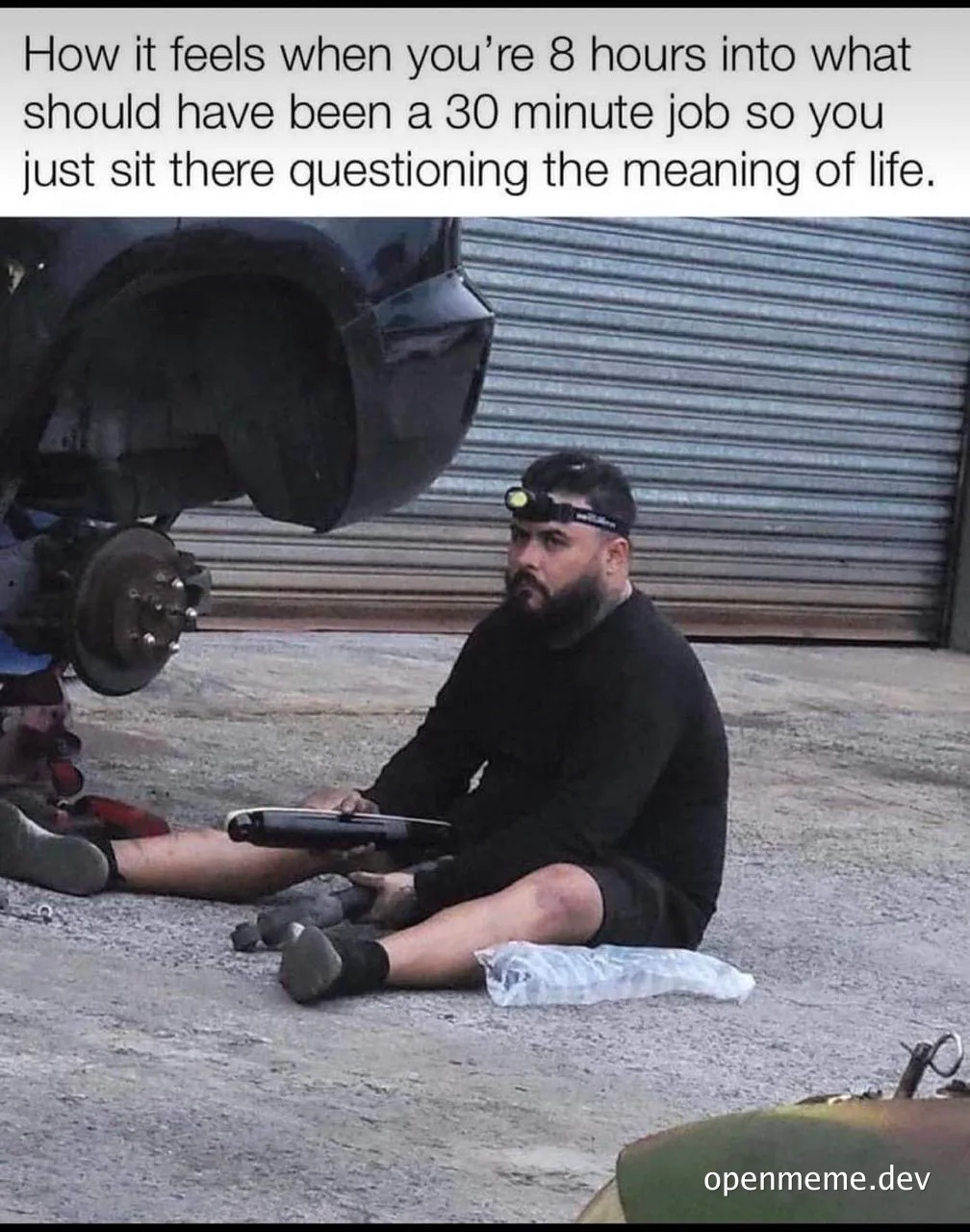 man sitting on ground under car questioning life