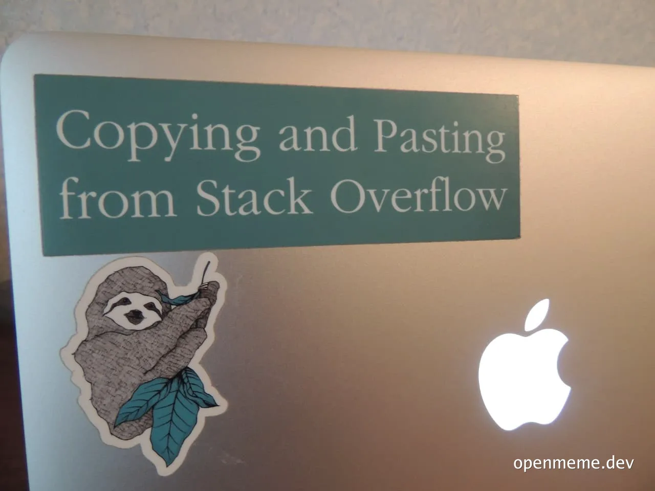 Sticker on a laptop reading 'Copying and Pasting from Stack Overflow'