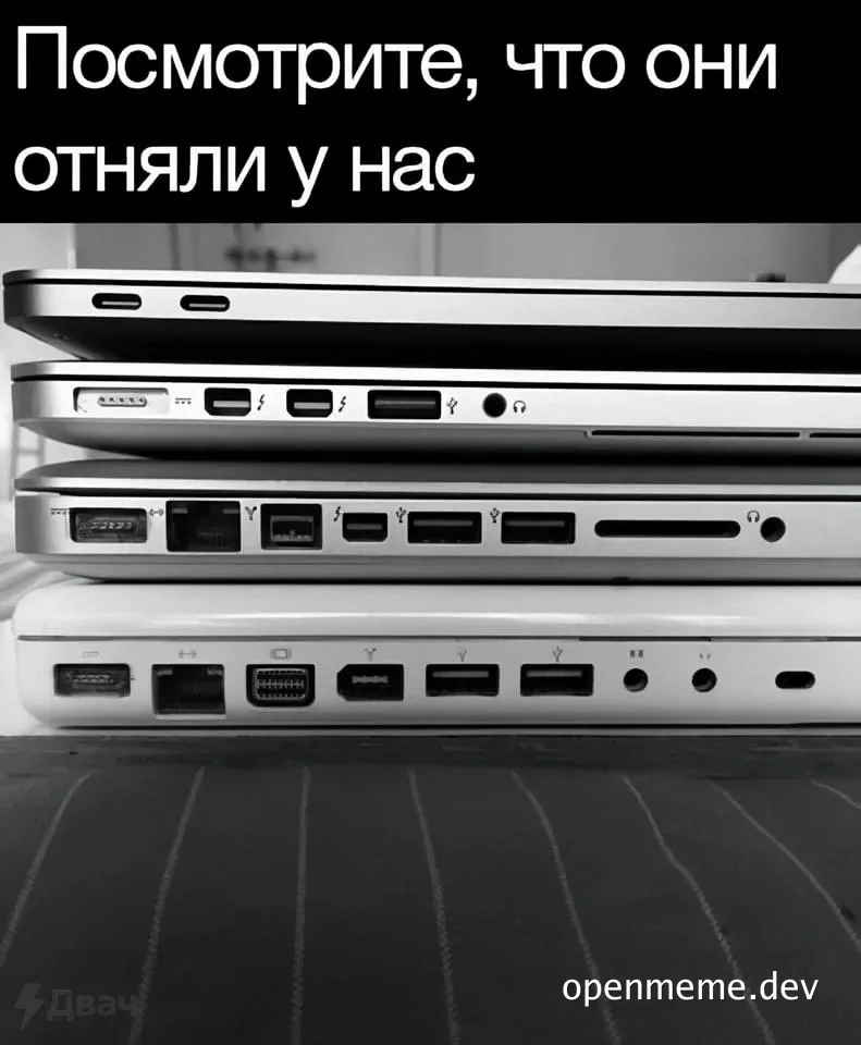a stack of old laptops with many ports