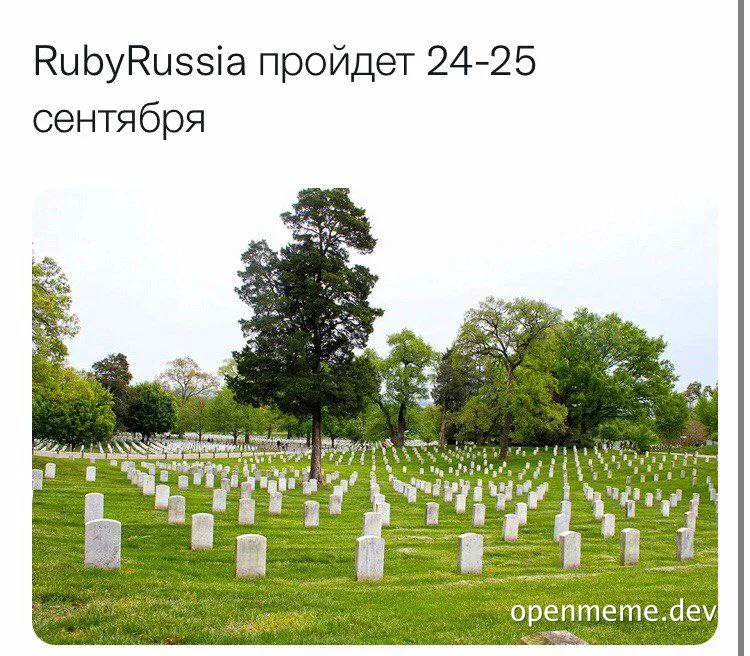 a graveyard with many white tombstones