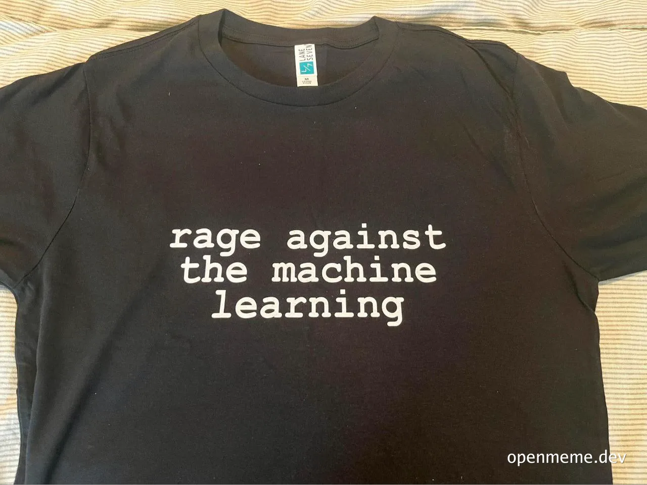 black t-shirt with white text 'rage against the machine learning'