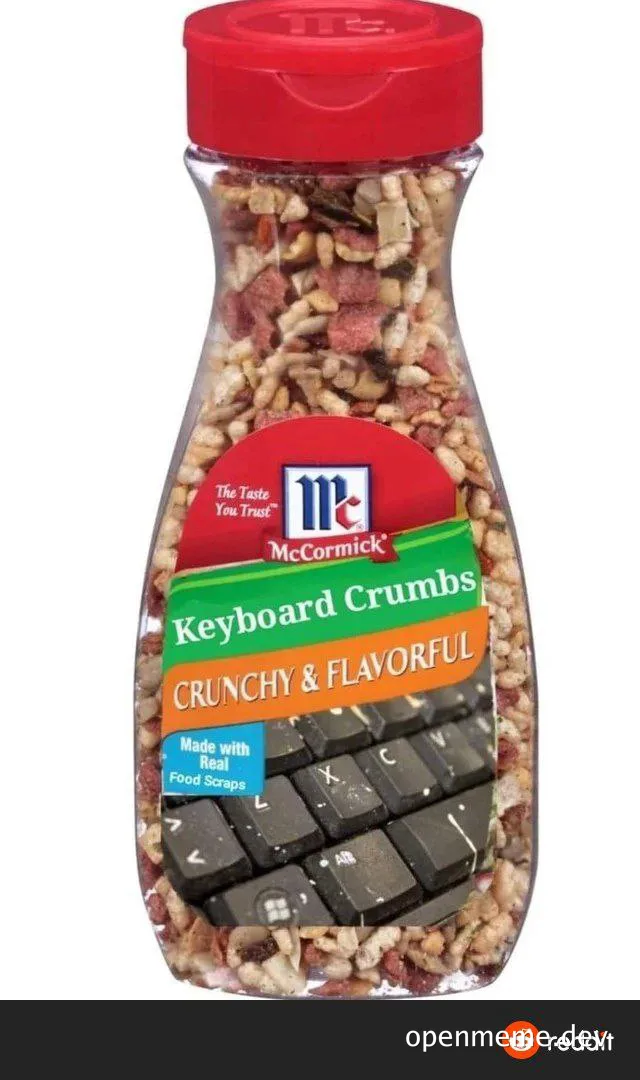 A jar of McCormick Keyboard Crumbs with a red lid and a label featuring a keyboard at the bottom