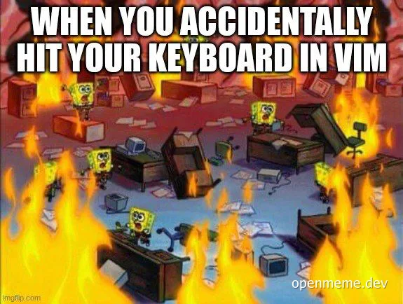 SpongeBob characters in a chaotic office setting with fire and destruction, representing the chaos of accidentally hitting keyboard in VIM.